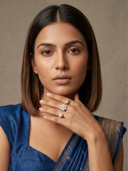 White floral Polki double finger ring with gold plated finish, colour stone centre, pear-shaped motifs and CZ detailing for bridal and festive looks