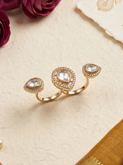 White Kundan Polki dual finger ring with gold plating and pear-shaped CZ details, designed as a statement accessory for ethnic wedding outfits.