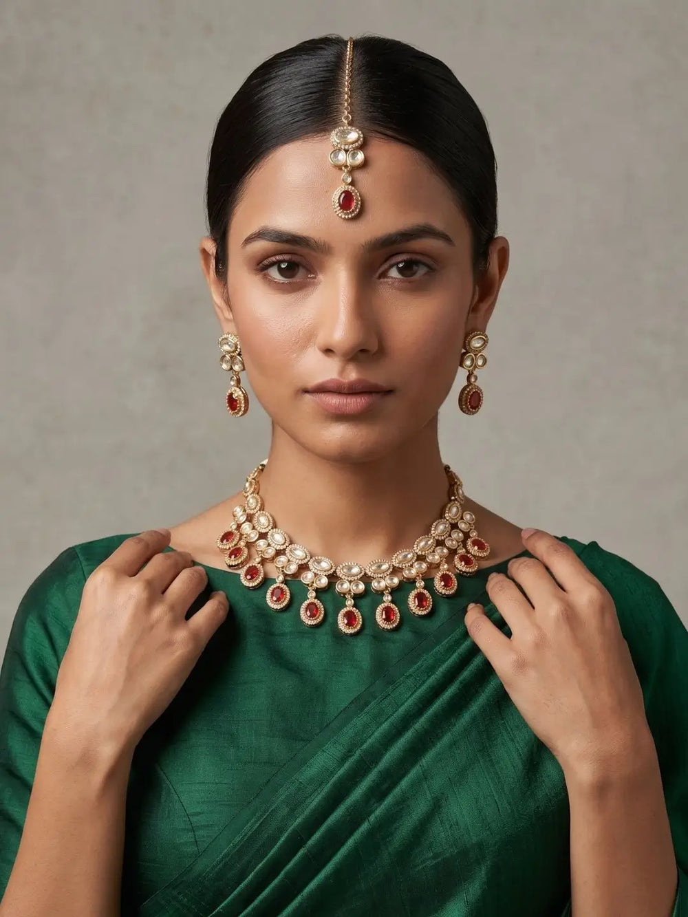 A women wearing a Gold Plated Polki Kundan Necklace Set With Tikka | Wedding & Festive Jewellery Set on a green saree
