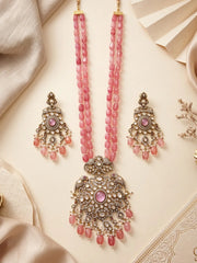 Traditional long antique moissanite polki necklace set with a big ornate pendant attached, rose pink layered beads, and matching long earrings for ethnic and saree wear