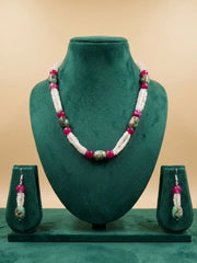 Handcrafted White Rainbow Moonstone faceted beads necklace with natural Turquoise oval beads, Pink Onyx gemstones, and matching earrings displayed on a decorative background.