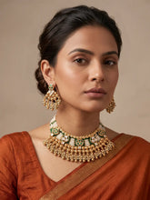 a women wearing a Traditional Antique Gold Plated Green Beaded Heritage Kundan Jewellery Set on a saree