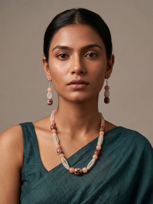 lady wearing an Elegant White Rainbow Moonstone and Brown Chalcedony Gemstones Beaded Necklace Set on a saree