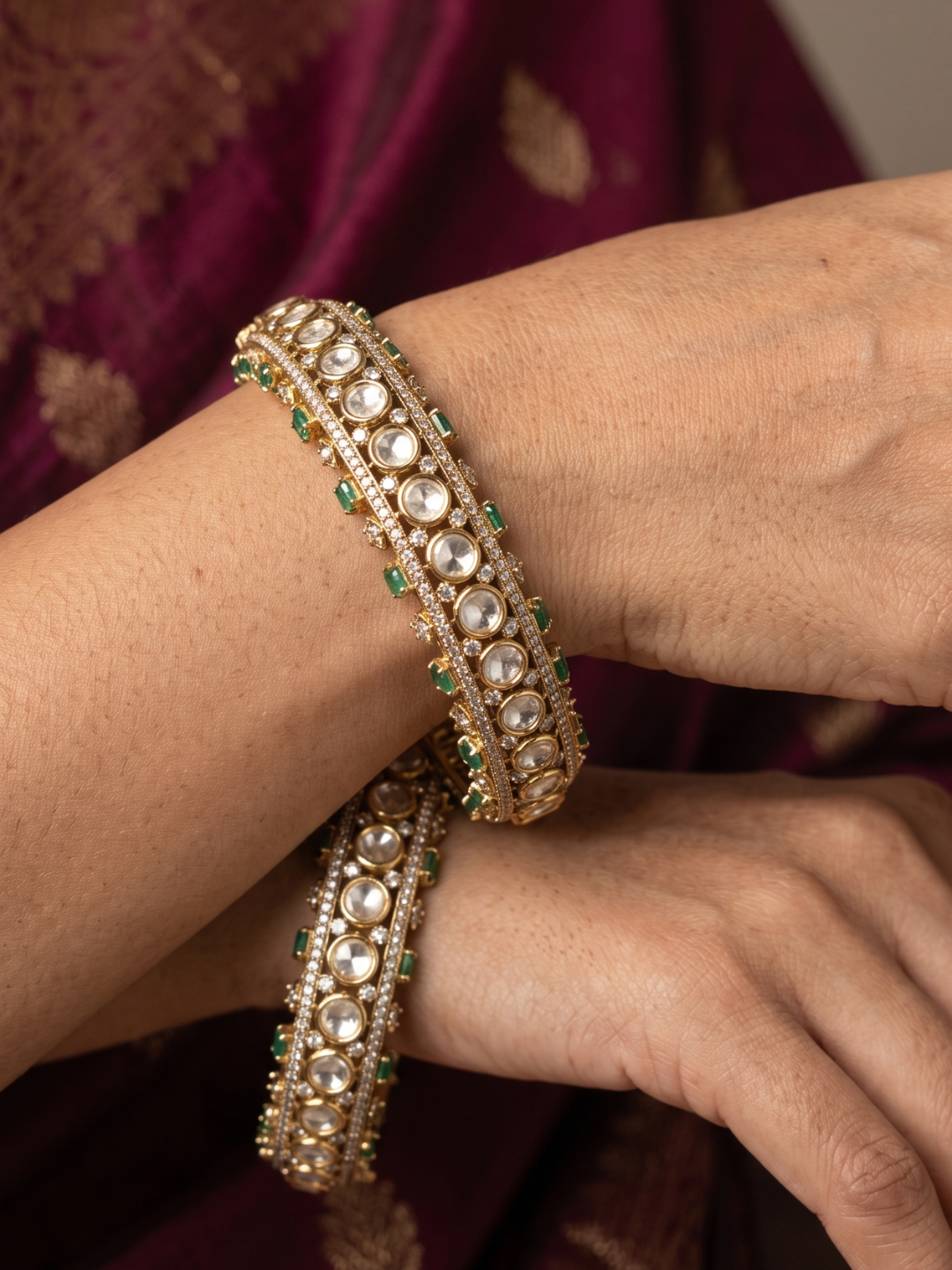 close up image of a women wrist wearing Luxury Antique Victorian Polki Kada Bangles With Emerald Stones | Wedding & Bridal Kada Bangles