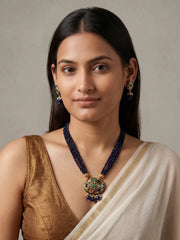Gold-plated black necklace featuring a multicolour Navratna Meenakari pendant, layered bead strands and matching stud earrings.
