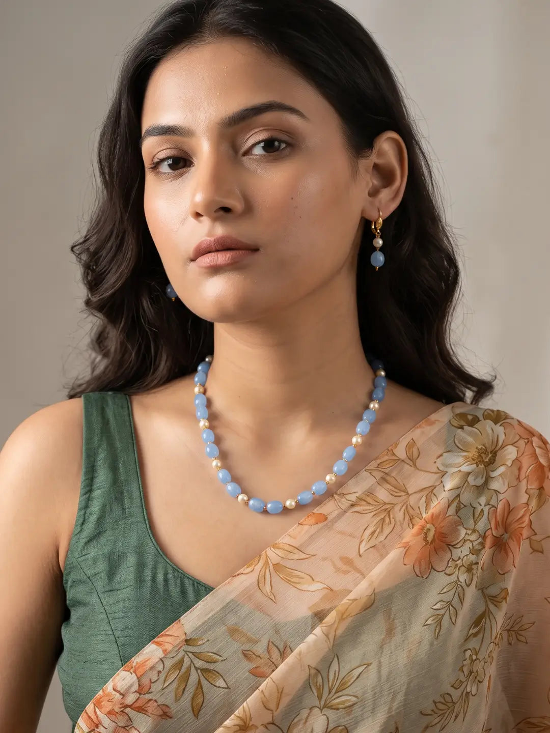 Single-strand blue box-shaped jade bead necklace with faux pearls, shown with matching drop earrings and gold-tone accents