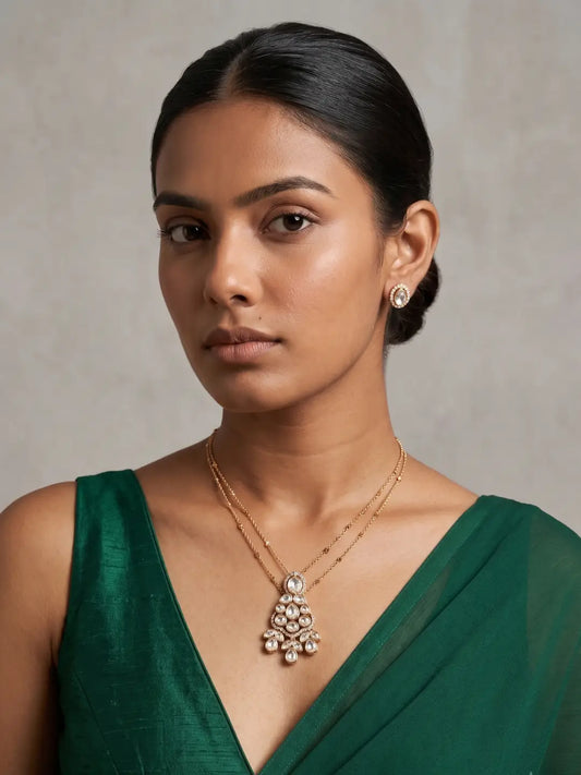 Gold-plated clear Polki jewellery set with a delicate chain, teardrop pendant and matching stud earrings for elegant festive and occasion wear