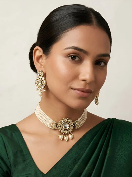 Woman wearing dual-tone mossanite polki and pearls beaded choker and earrings 