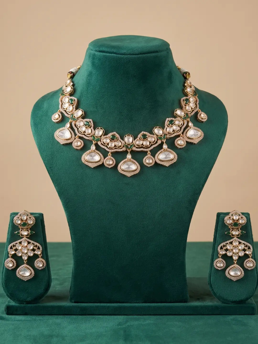 Emerald green polki necklace and earrings set with gold plating, adjustable dori and statement polki detailing for brides