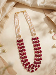 Traditional men's sherwani mala featuring ruby red jade beads, freshwater pearls and gold-tone decorative accents, creating a distinctive groom wedding look.