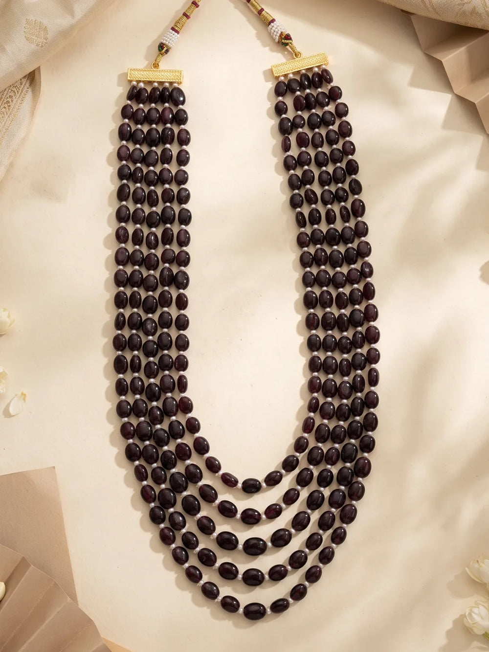 Five-layer garnet groom necklace featuring deep burgundy natural beads, contrasting freshwater pearls and a graduated silhouette suited to sherwanis.