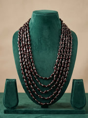 Five-layer dulha haar with polished oval garnet beads and lustrous freshwater pearls arranged in a rich cascading design for wedding attire.