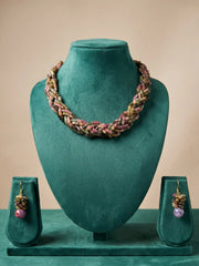 Gold-plated hook-and-eye closure at the back of a multi strand tourmaline beaded necklace, shown beside the layered gemstone strands