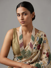 Long pearl necklace featuring white freshwater pearl strands accented with ruby red and emerald green jade beads for festive styling.