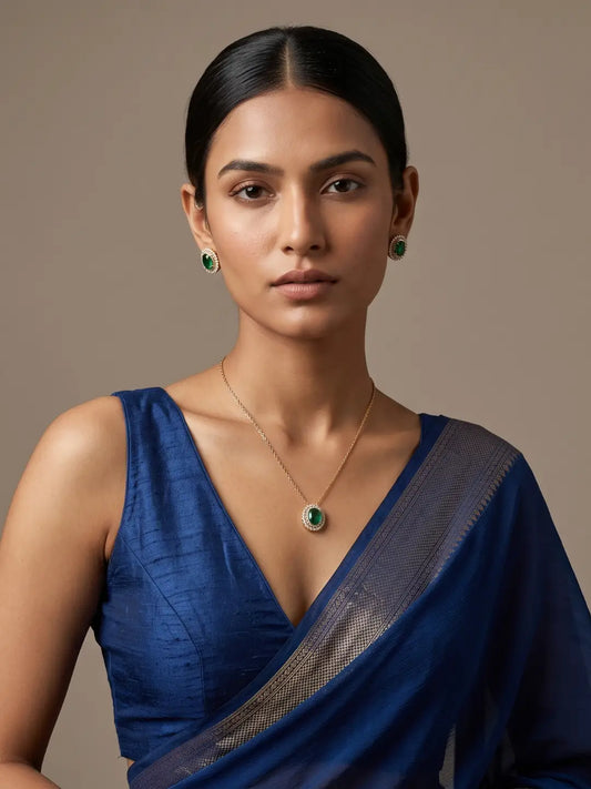 Gold-plated minimal jewellery set featuring a delicate chain necklace, oval green Kundan and CZ pendant, and matching stud earrings for women