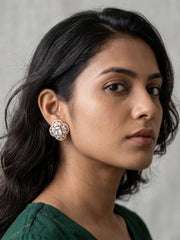 Gold-plated zircon stud earrings with a rectangular-cut centre stone surrounded by sparkling floral zircon motifs
