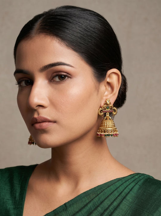 Traditional gold plated antique Jhumka earrings featuring Kundan stones, colourful gemstones, ornate floral detailing and decorative bead tassels.