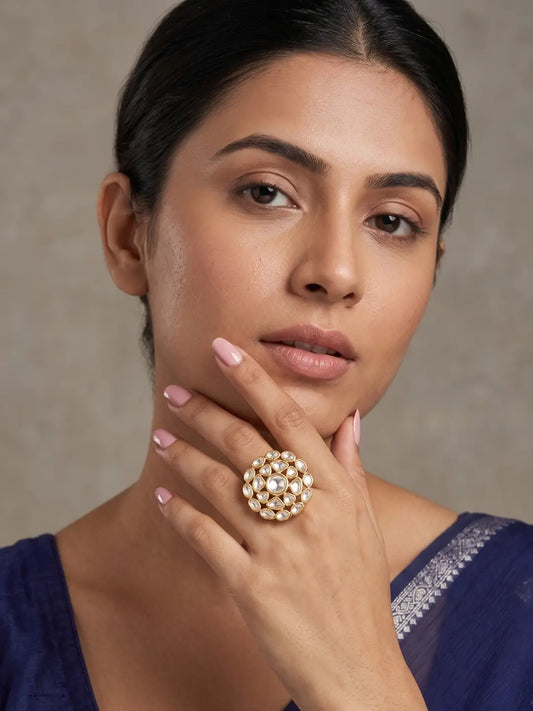Gold plated floral Polki ring with a brilliant round centre, pear and oval stones arranged in a layered design for sarees and bridal lehengas