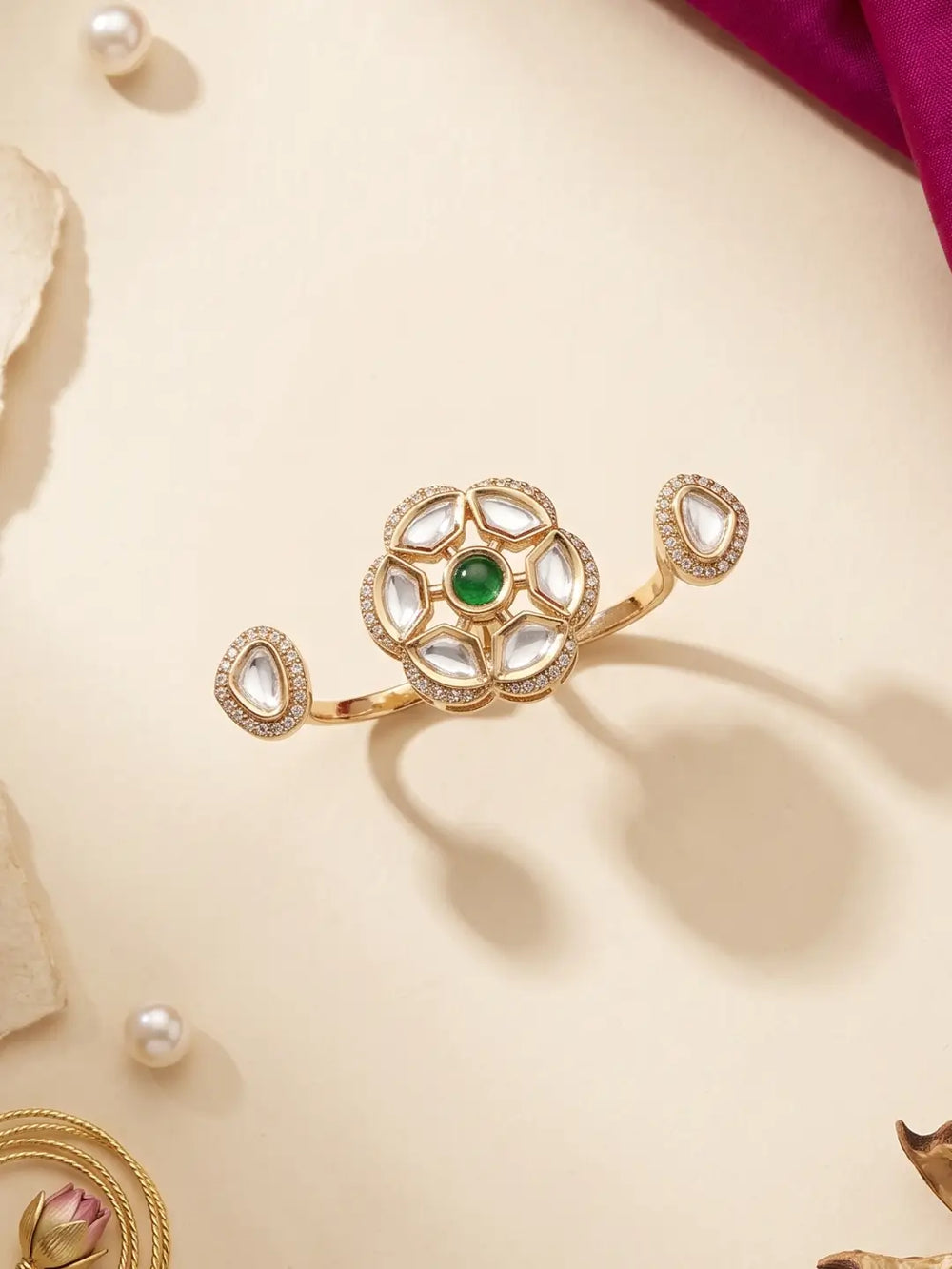 Gold plated green dual finger Polki statement ring with three connected focal elements, ornate Kundan stonework and a bold silhouette for ethnic outfits