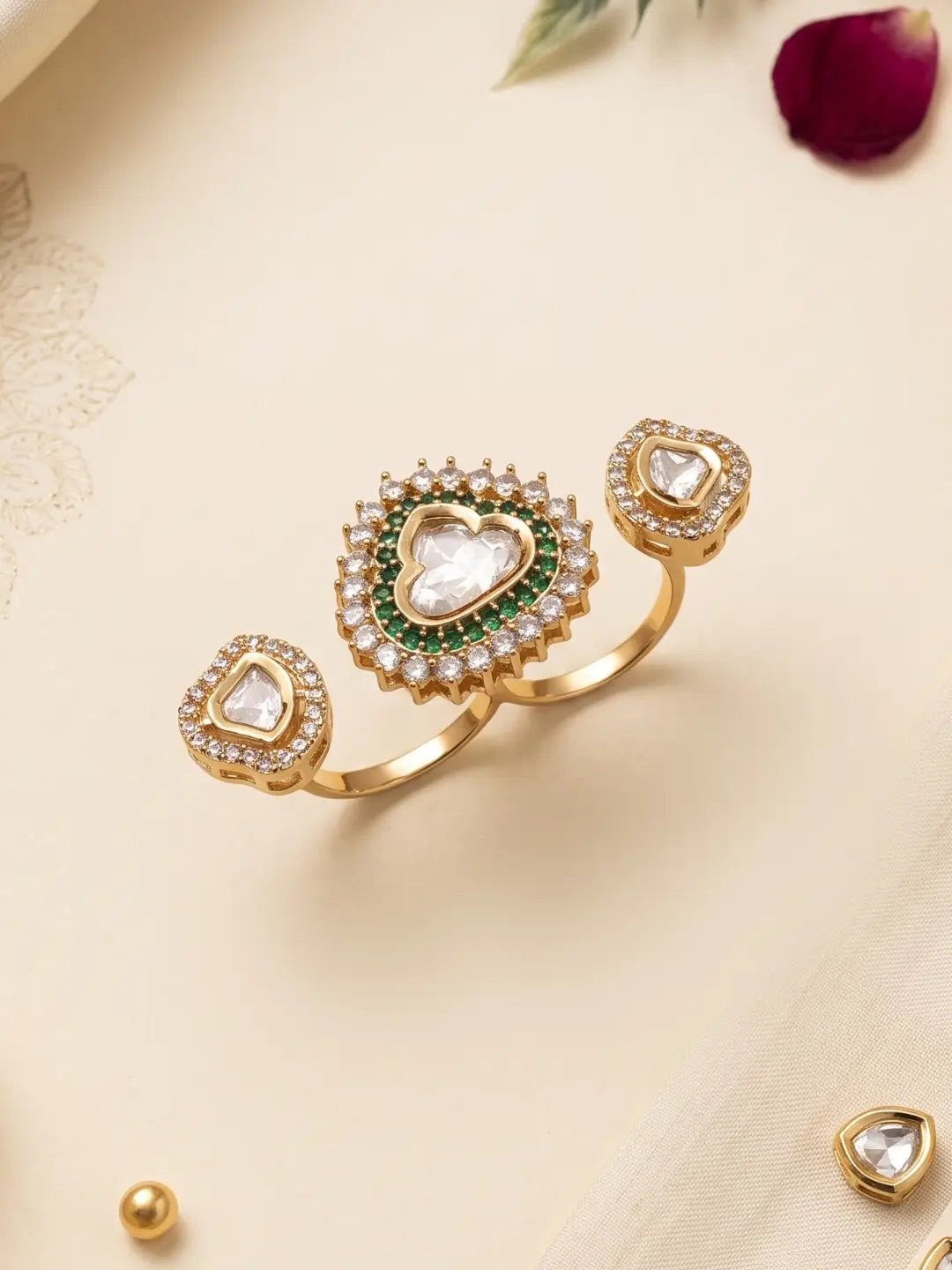 Gold plated green Kundan Polki dual statement ring featuring emerald accents, CZ imitation stones and a bold two-band design for ethnic outfits