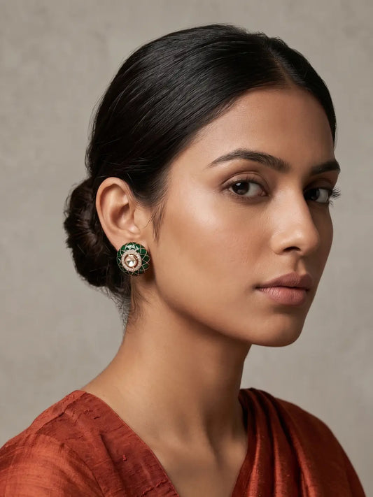 Gold plated green Kundan stud earrings with circular Meenakari-inspired detailing, raised centre polki stone and CZ accents