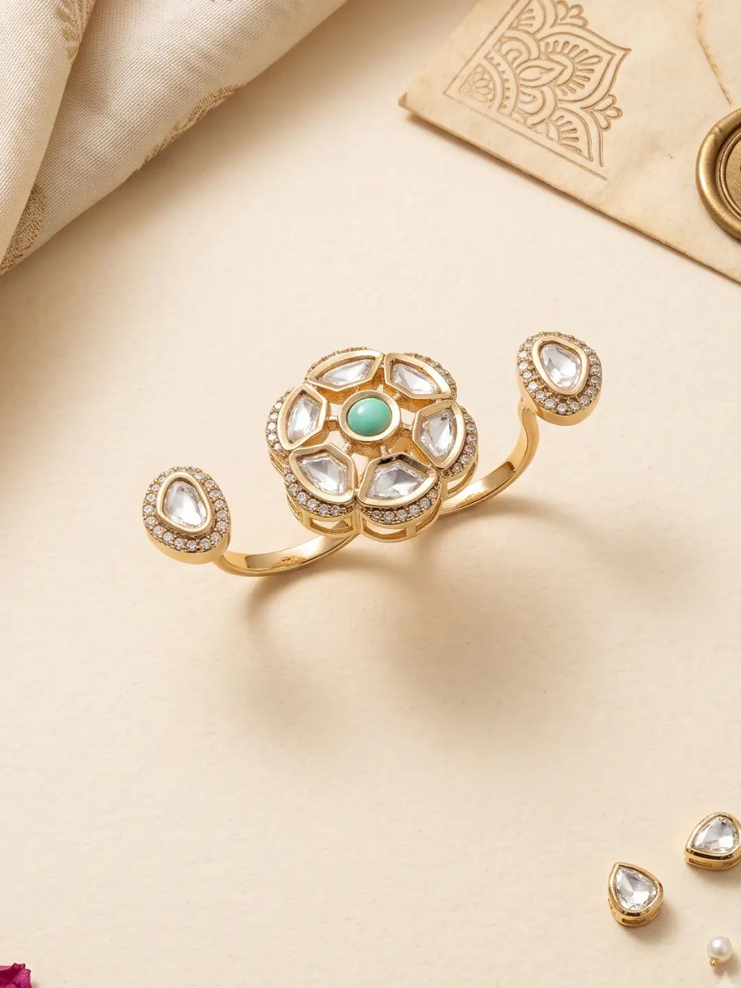 Gold plated mint green dual finger Polki ring with three connected focal elements and ornate Kundan detailing for sarees, lehengas and festive looks