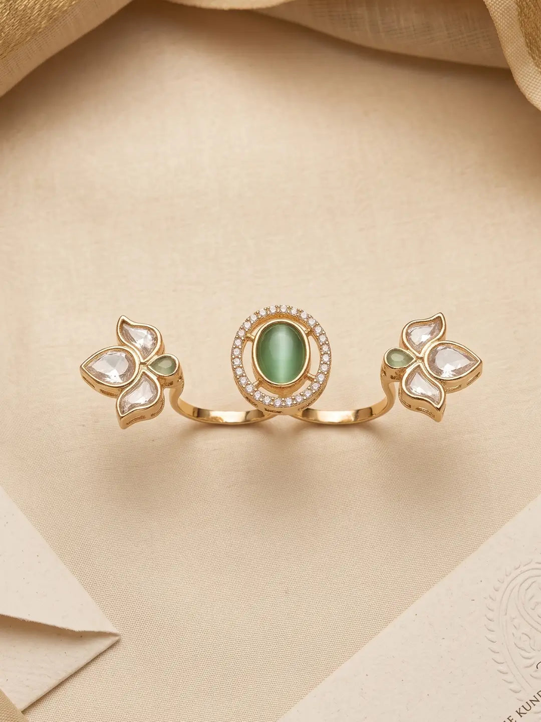 Gold plated mint green dual finger Polki ring with three connected floral clusters, sparkling centre stone and pear-shaped details for ethnic outfits