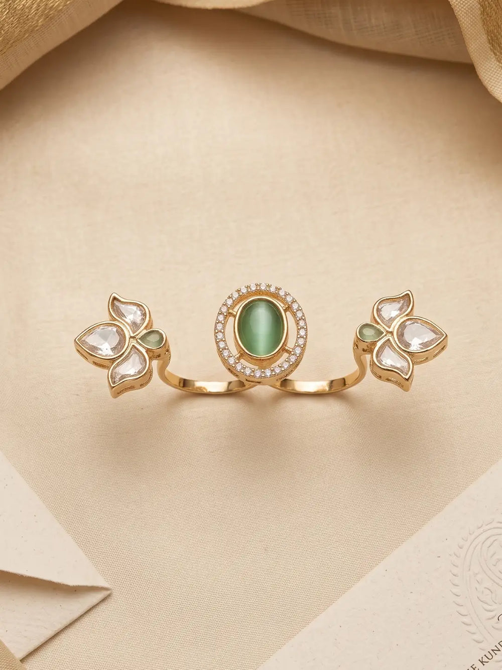 Gold plated mint green dual finger Polki ring with three connected floral clusters, sparkling centre stone and pear-shaped details for ethnic outfits