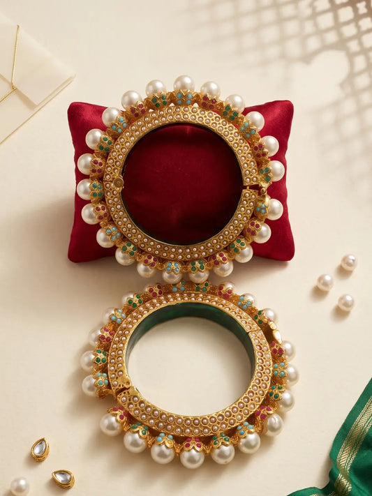Gold plated multicolour Pearl Pacheli bangles featuring turquoise blue, emerald green, deep pink and pearl-white accents for wedding styling.