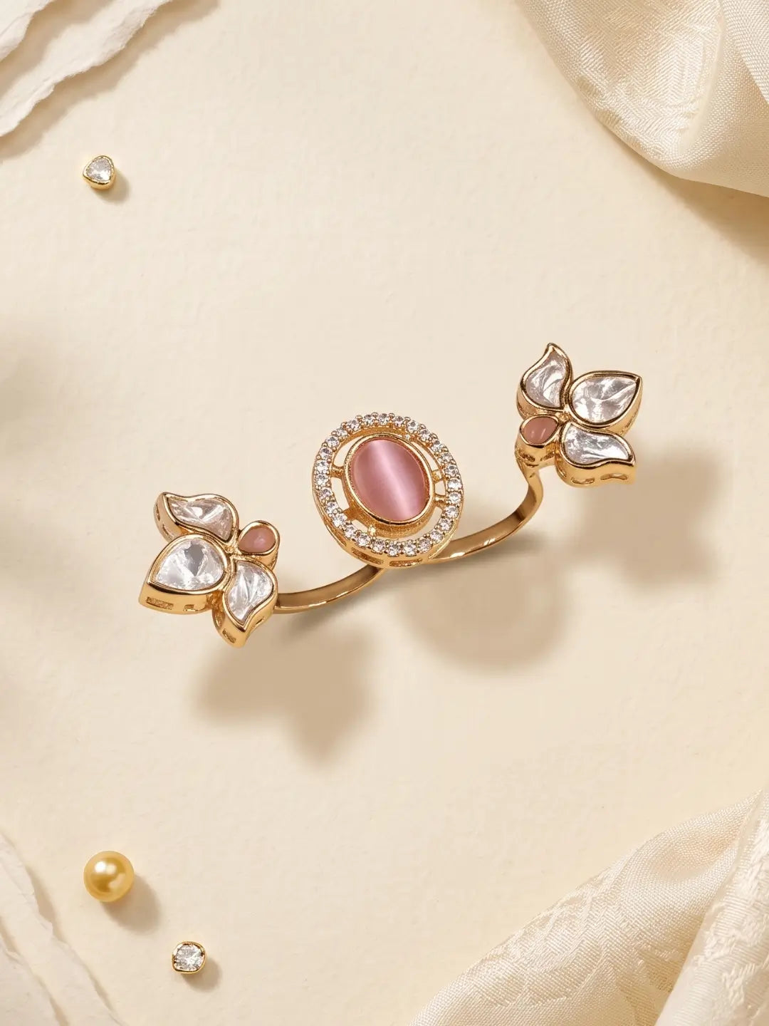 Gold plated pink dual finger Polki ring featuring three floral stone clusters, a round centre and sparkling CZ accents for bridal and ethnic outfits