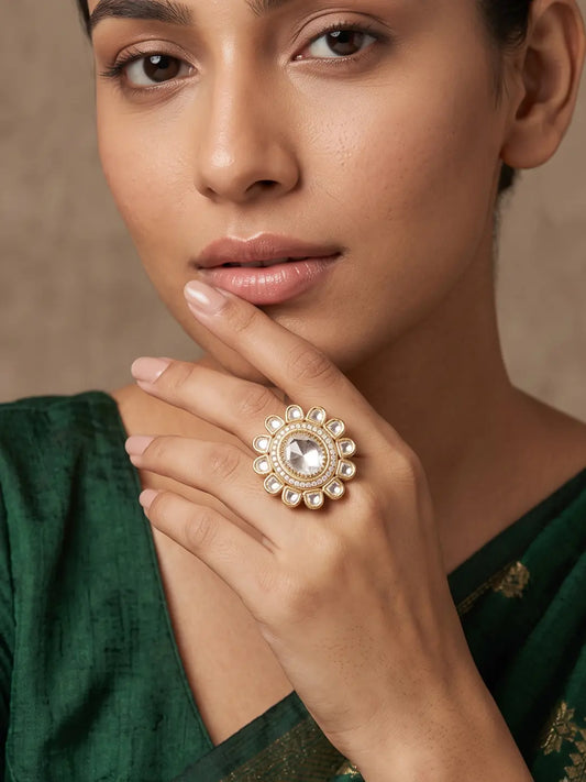 Gold plated Polki statement ring featuring a round centre stone, sparkling halo, petal-shaped accents and Kundan detailing for wedding and party looks