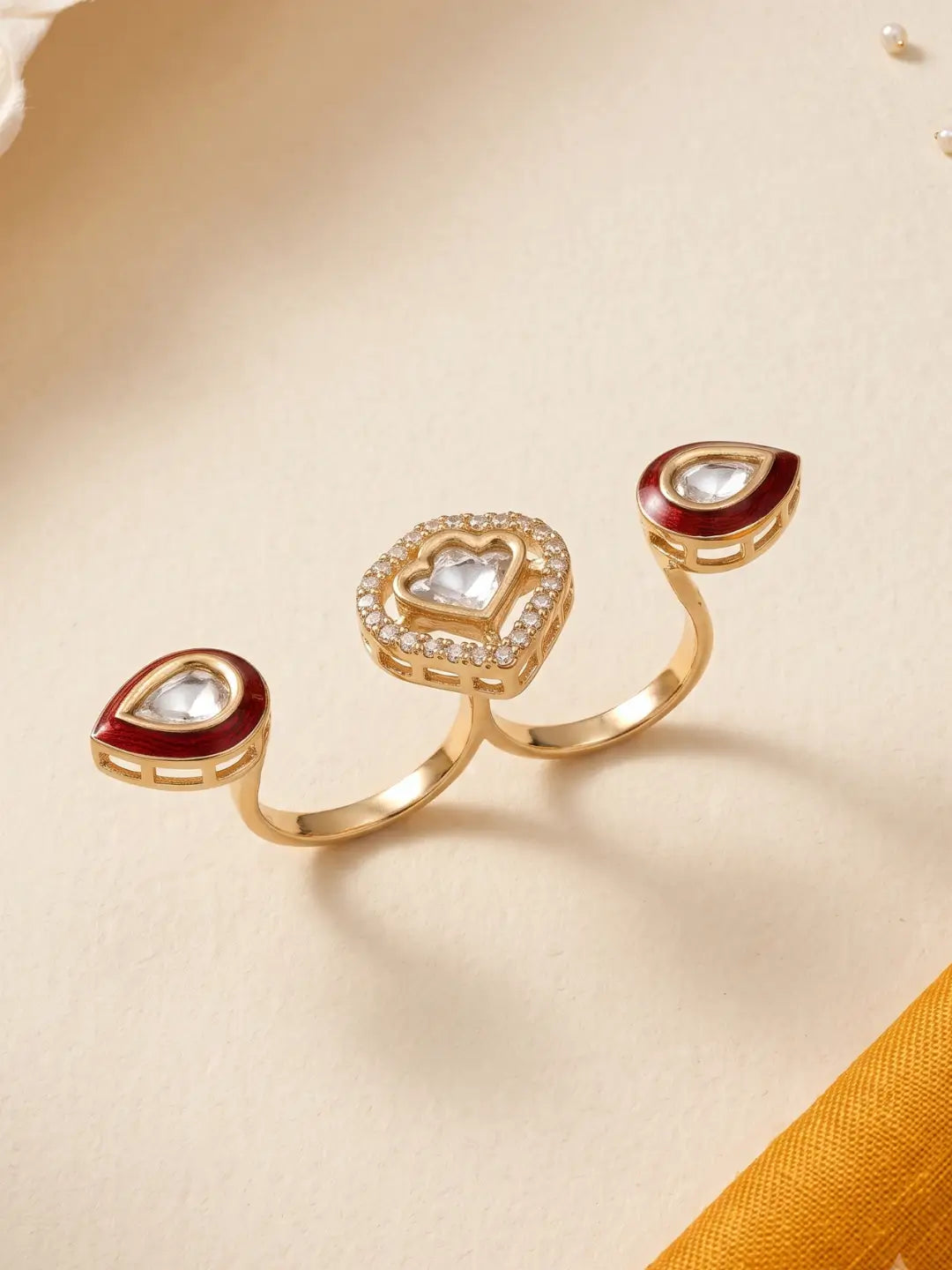 Gold plated ruby pink Polki dual statement ring featuring CZ accents, Meena enamel work and three connected focal elements for occasion wear