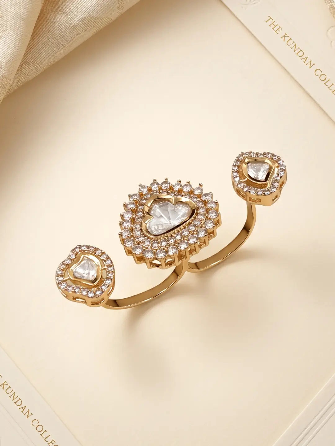 Gold plated white Kundan Polki dual ring featuring luminous stonework, CZ accents and a bold two-band silhouette for sarees and festive outfits