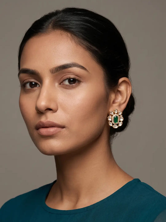 Green floral Kundan stud earrings with oval coloured centre stone, clear CZ stones and gold plated detailing for traditional outfits