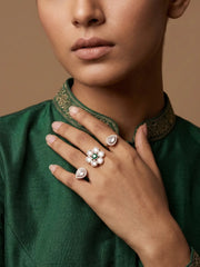 Green floral Polki double finger ring with gold plated finish, central colour stone cluster, pear-shaped motifs and CZ accents for ethnic styling