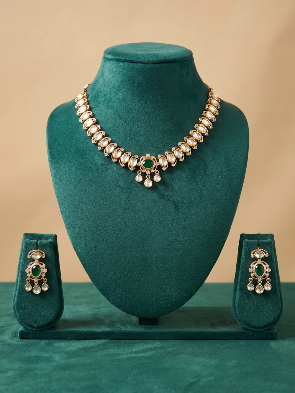 Green gold-plated choker set with Polki and CZ stone accents, oval floral detailing, and matching dangler earrings for festive and wedding outfits.