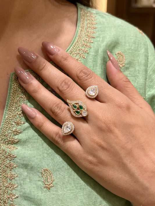 Green gold plated double finger ring with CZ, Polki-style and colourful stones, designed for bridal, wedding, party wear and festive looks.