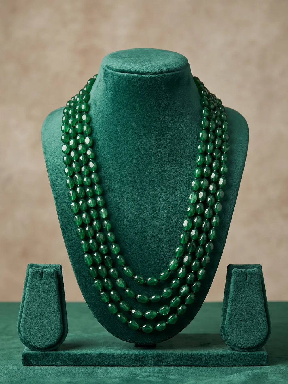Multi-strand green jade bead necklace for groom, featuring a rich green colour, elongated silhouette and adjustable dori for traditional wedding styling.