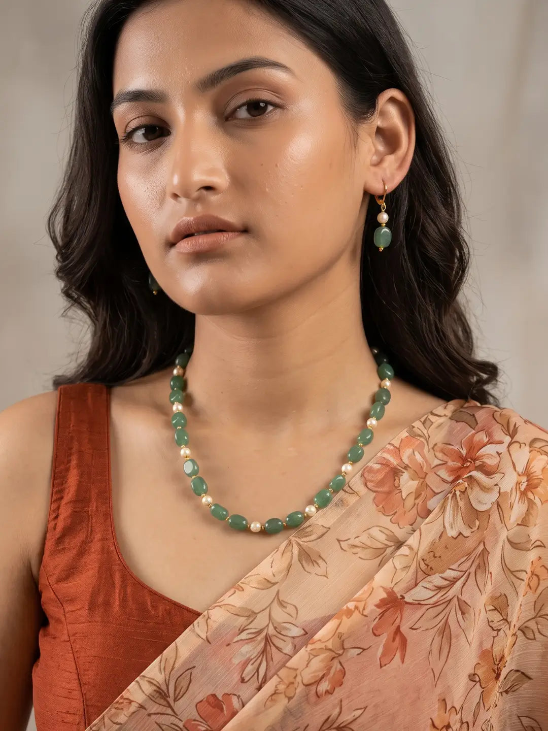 Single-strand green box-shaped jade bead necklace with faux pearls, shown with matching drop earrings and gold-tone accents