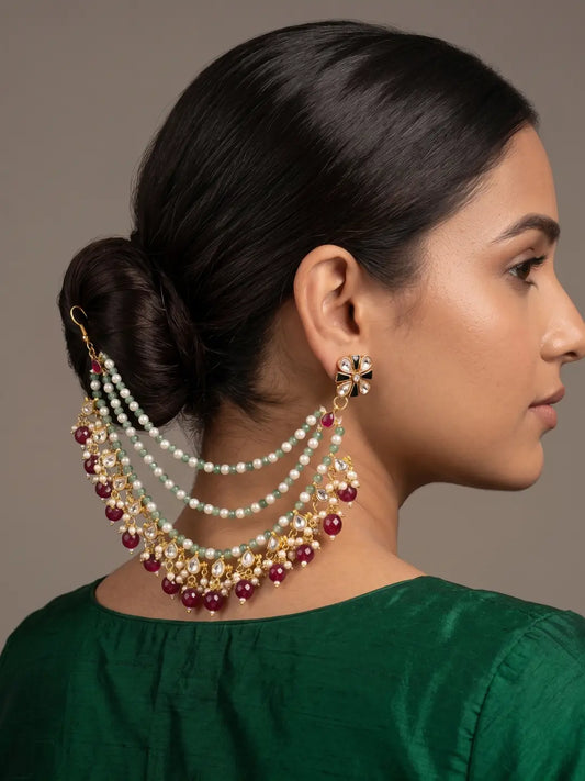 Green Kundan pearl ear to hair chain with maroon jade drops for Indian bridal bun and traditional wedding jewellery styling.