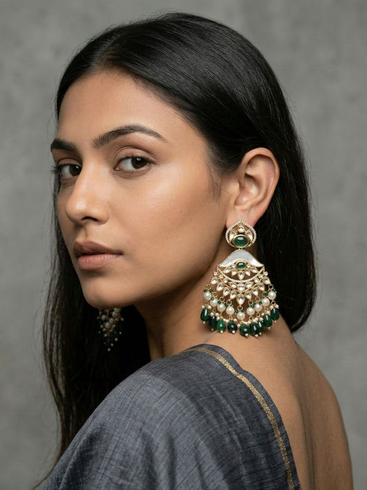 Green Kundan Polki Chandbali earrings featuring a luminous Mother of Pearl centre, detailed stonework and multiple pearl danglers.
