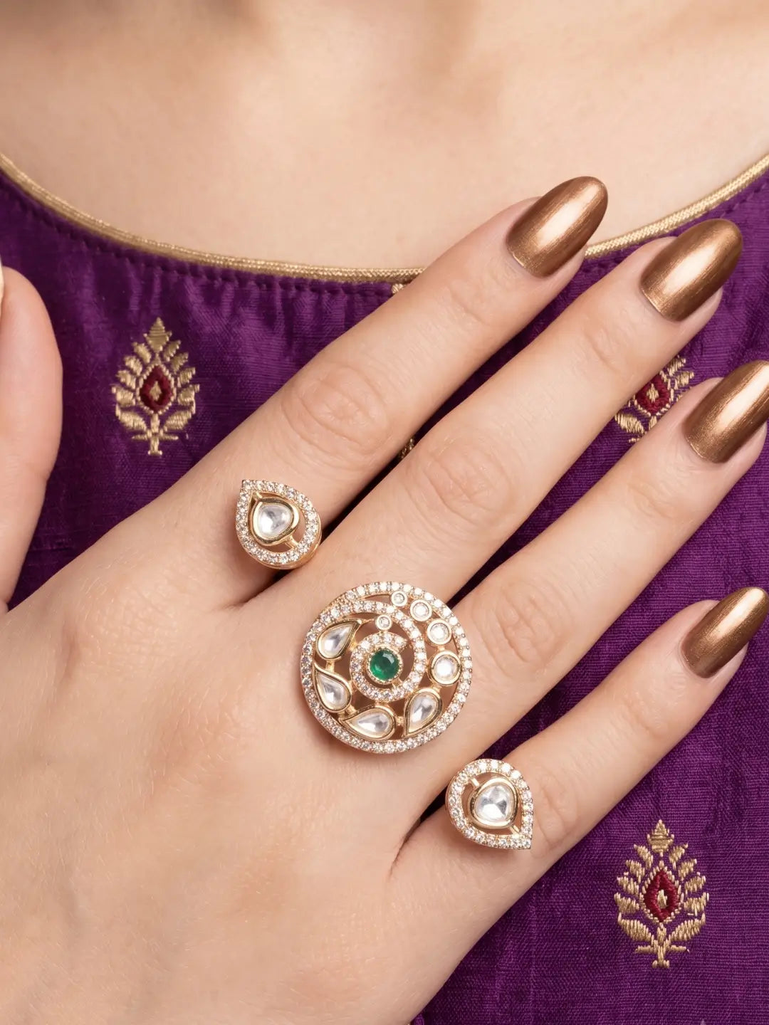 Green Kundan Polki dual finger ring featuring two connected gold-tone bands, floral stone clusters and CZ accents for wedding and Sangeet styling