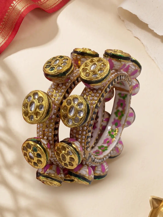 Green and pink Meenakari Kundan Pacheli kada bangles with pearl accents, floral detailing and gold plating for bridal and festive outfits