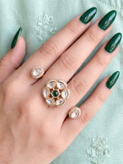 Green Polki Kundan double finger ring featuring two gold-tone bands, floral stone clusters and sparkling CZ accents for bridal and festive occasions