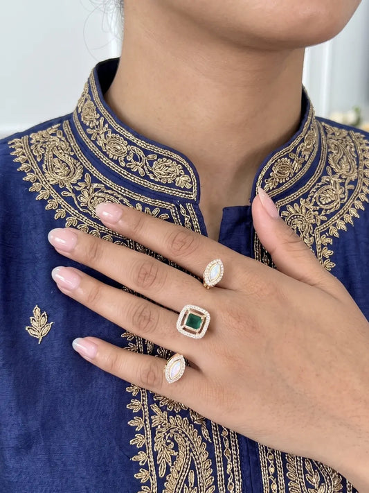 Green square-shaped Kundan Polki dual finger ring with gold plating and CZ details, designed for wedding, bridal, festive and party wear looks.