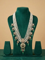 White pearl groom necklace with green bead accents, gold-tone Kundan leaf motifs, Polki details and dangling bead drops