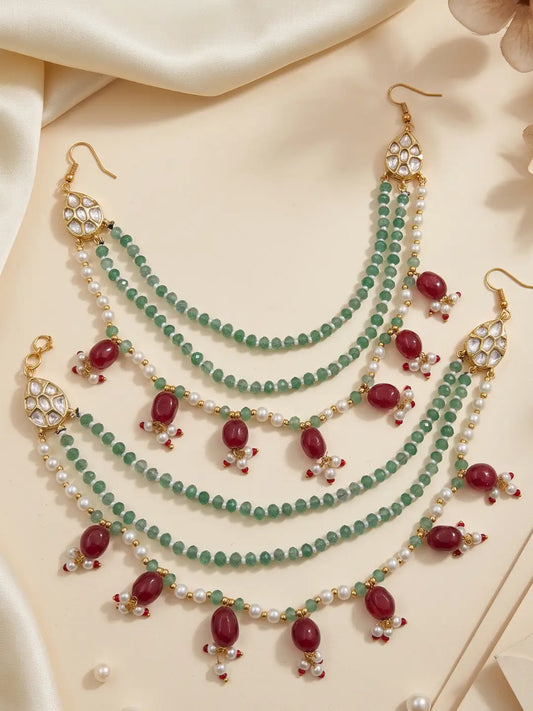 Layered green bead and pearl Kundan ear chain with maroon accents for bridal bun, Gajra and festive Indian wedding looks.