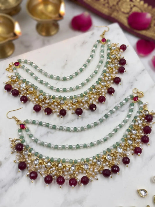 Layered green bead and pearl Kundan hair chain with maroon accents for bridal bun, Gajra and South Asian wedding hairstyles.