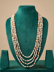 Layered freshwater pearl necklace styled with an ethnic outfit, showing how the cascading strands drape gracefully around the neckline
