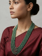 Long green jade and freshwater pearl necklace featuring multiple graduated strands for a layered ethnic jewellery look.